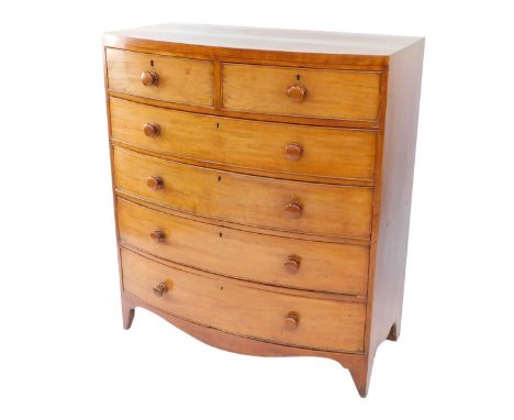 A George III mahogany bow front chest, of two short and four long drawers, each with bun handles, raised on bracket feet, 122