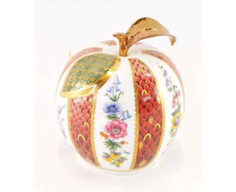 A Royal Worcester porcelain apple paperweight, with gilt detailed leaf, The Connoisseur Collection, printed mark, 8cm high. (