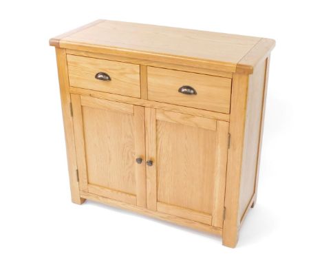 A modern light oak cupboard, with two short drawers over two cupboard doors, on stile feet, 84cm high, 89cm wide, 40cm deep.