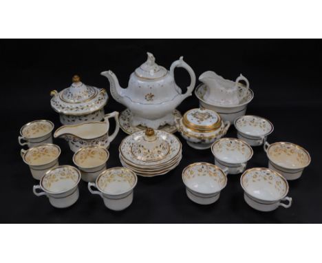 A group of early 19thC porcelain tea wares, gilt decorated with flowers, including a teapot, sucriers, cream jugs, tea cups a