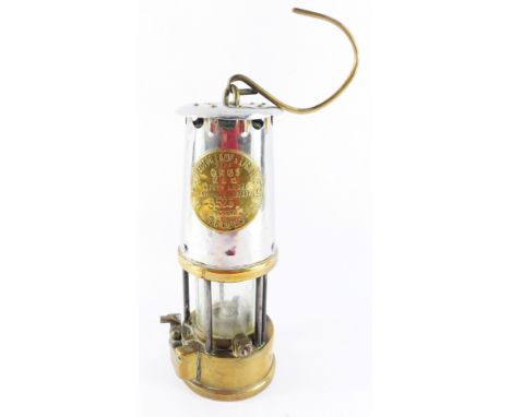A Protector Lamp &amp; Lighting Co Ltd miner's safety lamp, type GR6S, numbered 3523, Eccles, 25cm high. 
