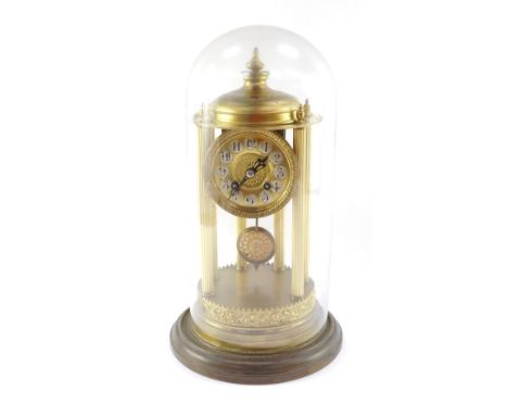 A continental brass mantel clock, the circular dial with silvered Arabic numerals, eight day movement striking on a bell, the