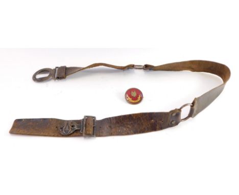 A leather boy scout belt, and a red enamel boy scout fox pin. (2)