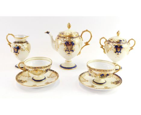 A Noritake porcelain tete-a-tete, comprising teapot, sugar bowl, milk jug and two cups and saucers each elaborately decorated