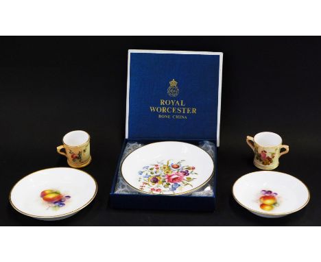 A group of Royal Worcester porcelain, comprising two Royal Worcester pin dishes painted with fruit, a Royal Worcester blush i