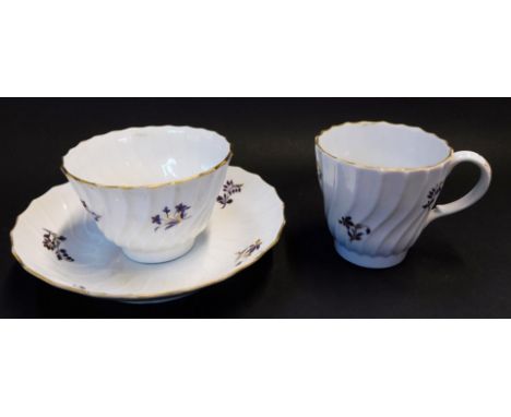 A Barr Worcester porcelain trio, circa 1792-1807, of spiral fluted form, decorated in purple and gilt with floral sprigs, B m