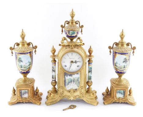 An Imperial gilt metal and porcelain clock garniture, comprising mantel clock stamped Imperial Italy, enamel dial bearing Rom