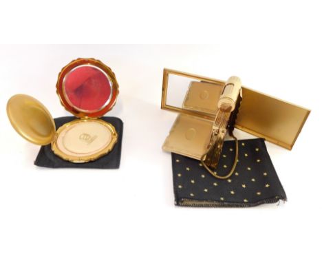 A Kigu vintage lady's compact, with mirror, lipstick and cigarette holder, boxed, together with a Stratton compact, both with
