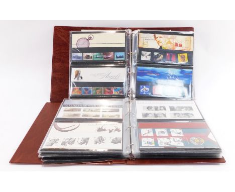 Two albums of Royal Mail presentation packs and first day covers, to include Christmas, farm animals, Harry Potter, Classics,