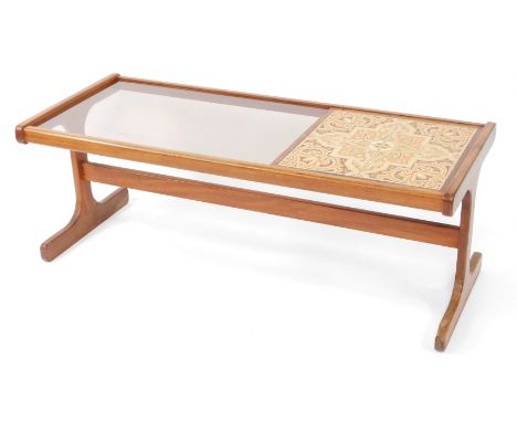 A 1970s teak coffee table, with rectangular glass inset panel and four tile design top, 45cm high, 121cm wide, 50cm deep.