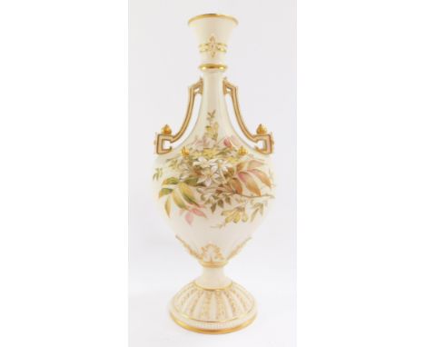 A Royal Worcester blush ivory porcelain vase, circa 1892, of twin handled, baluster form, painted with meadow flowers and blo