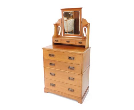 A Victorian light mahogany dressing chest, with rectangular mirror plate, on shaped supports, with shaped and moulded brass h