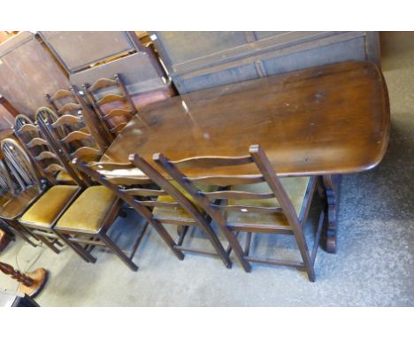 An Ercol refectory table and six chairs