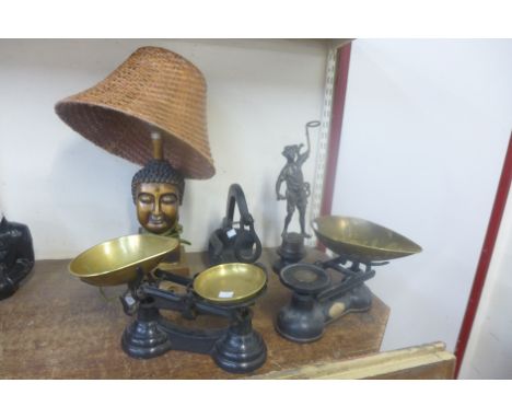 Two sets of scales, figural table lamp, wine bottle holder and a cast metal figure