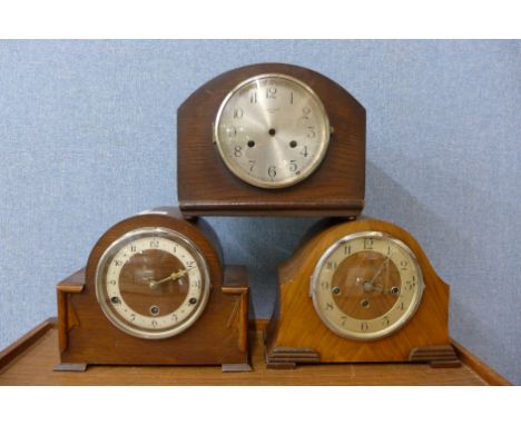 A walnut mantel clock and two oak mantel clocks