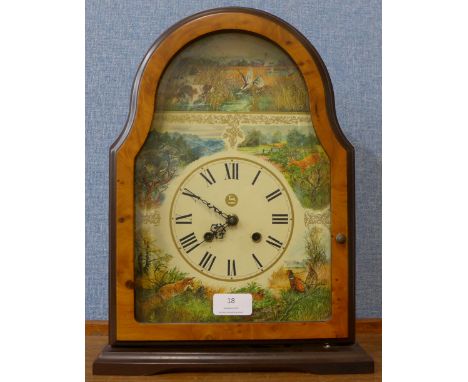 A faux maple mantel clock 