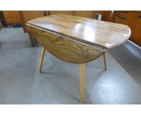 An Ercol drop-leaf table