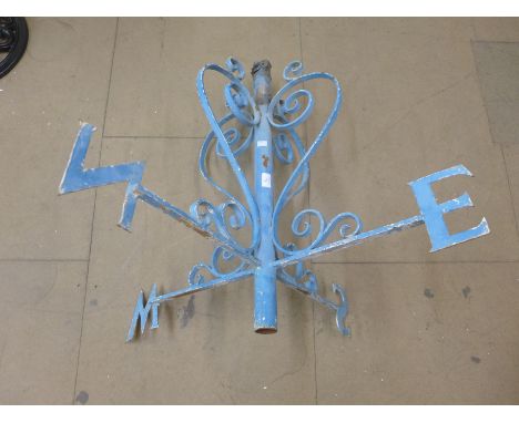 A wrought weather vane top