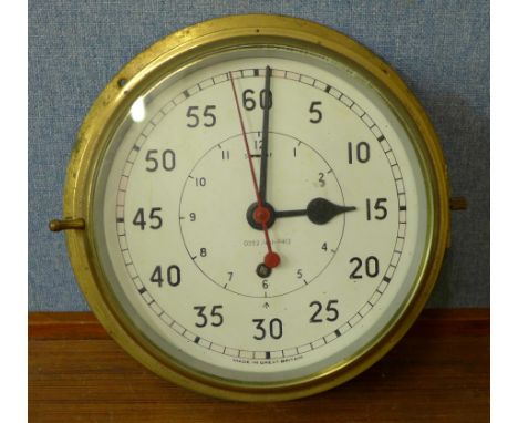 A military issue brass cased ship's clock, broad arrow mark to dial, numbered 0552/461-9413