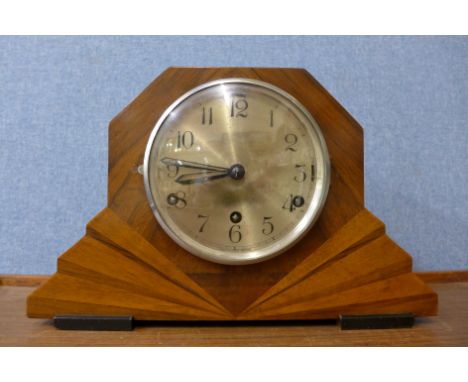 An Art Deco walnut mantel clock