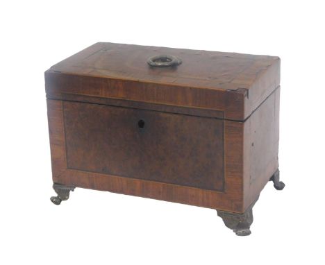 A 19thC amboyna and kingwood cross banded tea caddy, the hinged lid enclosing lined tin compartments, on paw feet, 22cm wide.