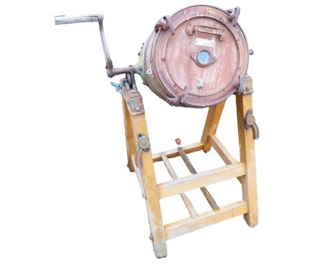 A 50L butter churn, on a painted pine stand, 108cm high.