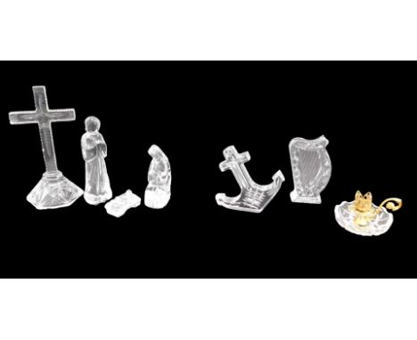 A Waterford crystal harp shaped paperweight, a Waterford figure of Mary and Joseph, anchor, cross, etc.
