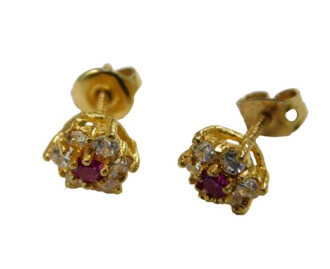 A pair of 22ct gold ruby and white stone flower hear earrings, on screw fittings, 2.6g.