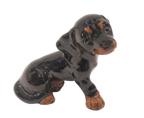 A Goebel Dachshund puppy, 20cm long.