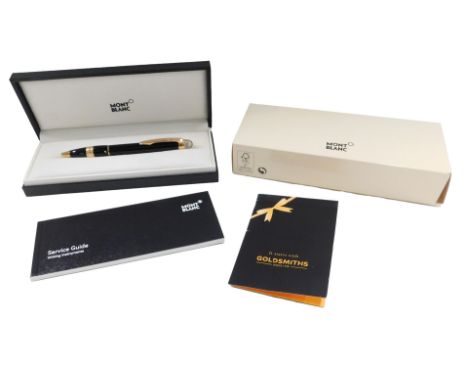 A Mont Blanc Starwalker red gold plated resin ballpoint pen, boxed and with paperwork.