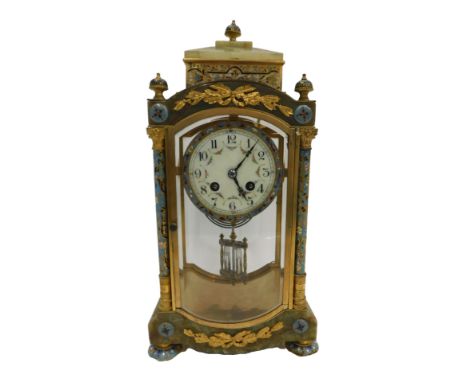 A late 19th/early 20thC French onyx ormolu and champleve enamel four glass mantel clock, the stepped top decorated with finia