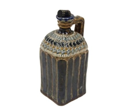 A Doulton Lambeth square section whisky flask by Ethel Beard, decorated with stylised leaves, etc., above blue mottled glazed