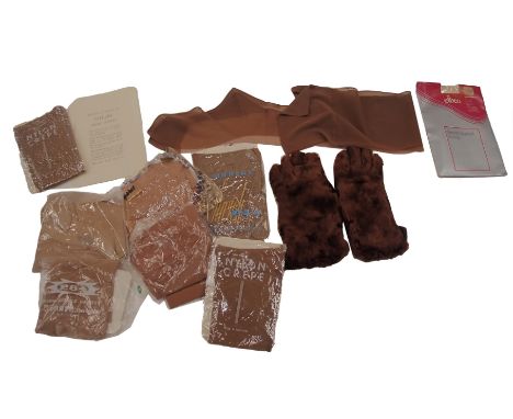 A collection of vintage lady's tights, and a pair of fur gloves.