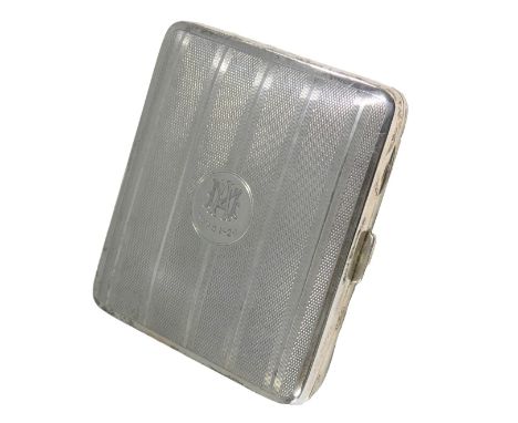 A George V silver cigarette case, with engine turned decoration, the lid engraved with monogram MA Xmas 1926, Birmingham 1926