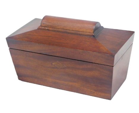 A 19thC mahogany sarcophagus shaped tea caddy, the hinged lid enclosing two lidded compartments, 24cm wide.