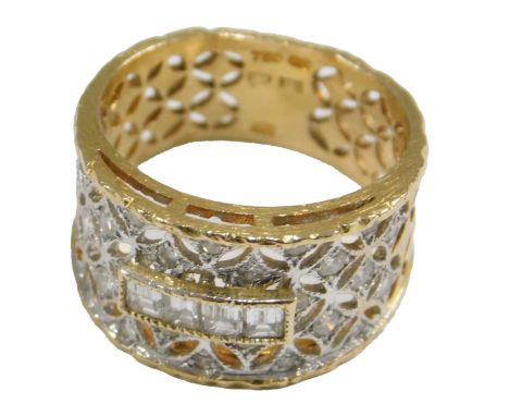 An 18ct gold and diamond Russian style ring, set with four emerald cut diamond, within an open work setting of further brilli