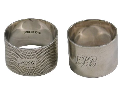 A plain cylindrical silver napkin ring, engraved initials VJB, and an engine turned napkin ring also bearing initials, 3.2oz.