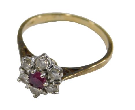An 18ct gold ruby and diamond flower head ring, the circular ruby in a surround of six diamonds, diamonds approx ¼ct, size R,