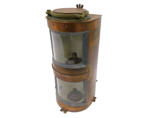 A copper and brass ships lamp, converted to electricity, 51cm high.