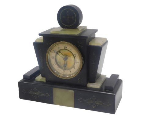 An Art Deco black slate and green onyx mantel clock, the paper dial stamped Made in France, 33cm wide. (AF)