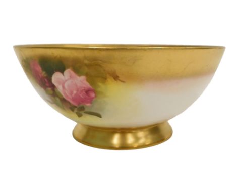 A Royal Worcester bowl, painted with roses within gilt borders, printed mark in puce to underside, 21cm diameter.