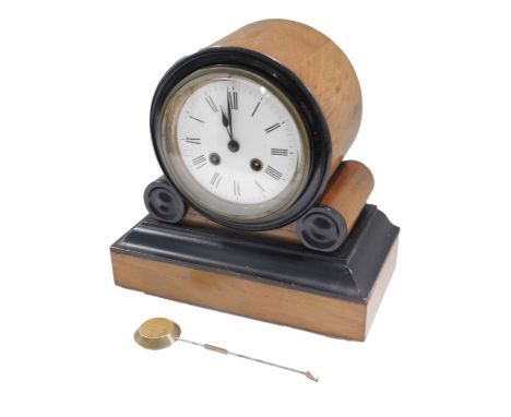 A late 19thC French walnut and ebonised mantel clock, the enamel dial with Arabic numerals, 24cm high.