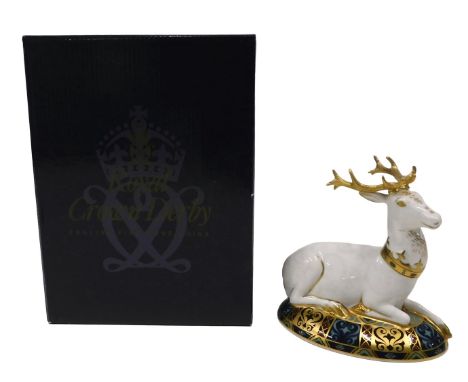 A Royal Crown Derby limited edition porcelain paperweight, The White Hart, number 1638/2000, gold button, boxed.