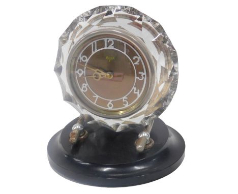 A Majak Russian mantel clock, with glass case, chrome mounts and early plastic base, 20cm high.