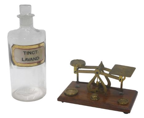 A set of brass and mahogany letter scales, 17cm wide, and a chemist bottle (AF).