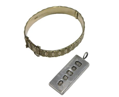 A silver bangle, in a textured interlock circular design, on a snap clasp, with safety chain as fitted, together with a 1oz i
