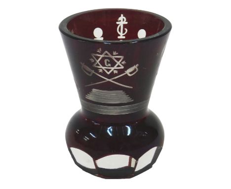 A Bohemian masonic ruby flash shooting glass, decorated with various symbols to include cross swords, star, sun, etc., 9cm hi