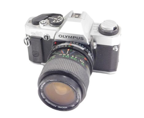 An Olympus OM20 camera, with lens.
