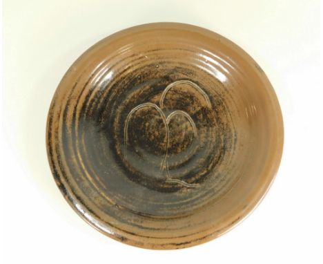 JEREMY LEACH A shallow dish incised with willow tree motif. Various personal &amp; Pottery marks. Diameter 26cm