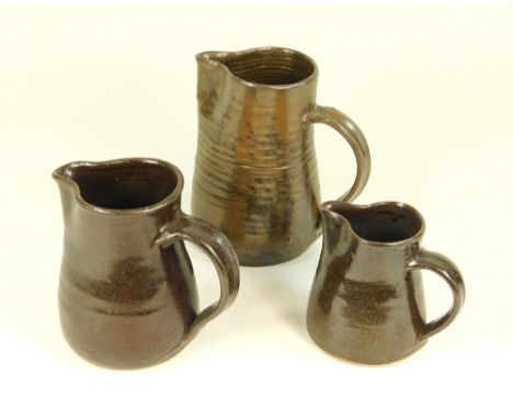 JEREMY LEACH Three jugs. A pint jug &amp; two smaller. All with personal or Pottery marks.